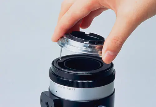 The mount part of the TAMRON Adapt-A-Matic universal interchangeable lens mount system for SLR cameras and lenses supporting auto-focus